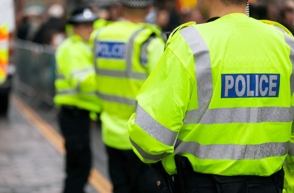 group of police men, stood in high-vis