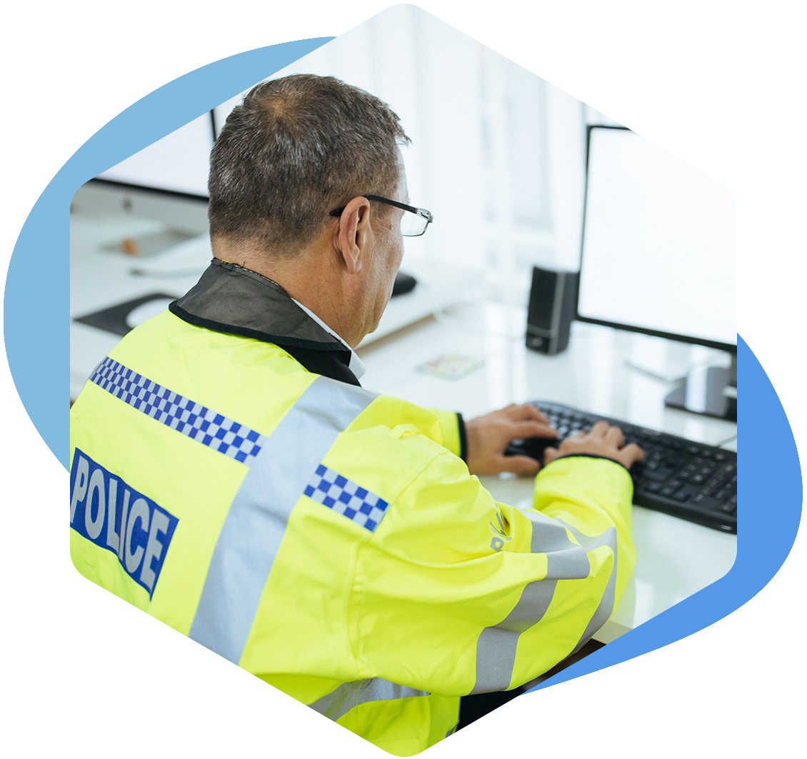 policeman working on computer