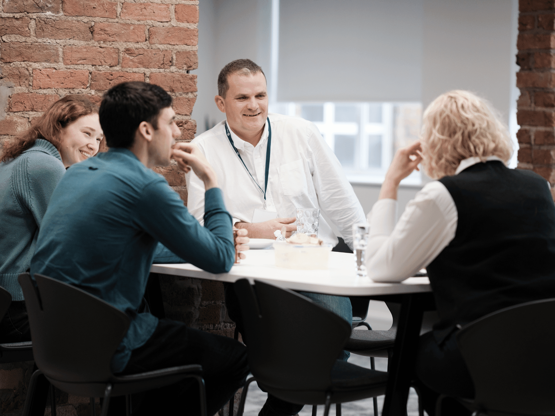 Simpson Associates team seated around a table.